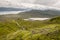 Tourists and hikers ascending and descending The Storr mountain and enjoying the view