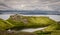 Tourists and hikers ascending and descending The Storr mountain and enjoying the view