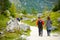 Tourists on a hiking trails around picturesque Konigssee, known as Germany`s deepest and cleanest lake, located in the extreme so