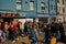 Tourists and holiday makers visiting the coastal and seaside town of Cromer in Norfolk forming an orderly queue for takeout fish