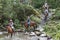 Tourists on horse back in the jungle of Colombia