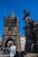 Tourists at the iconic medieval Charles Bridge in a beautiful sunny day at early spring