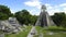 Tourists At The Jaguar Temple In Tikal Guatemala