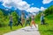 Tourists joyfully jump up against the background of snow-capped mountains.