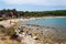 Tourists on Kamenjak peninsula beach by the Adriatic Sea in Premantura, Croatia