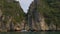 Tourists in kayaks or canoes exploring the caves and limestone islands of Ha Long Bay, Vietnam