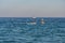 Tourists in kayaks swim the Mediterranean Sea