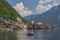 Tourists lake cruise boat on Hallstattersee by the World Heritage lakeside town in the Alps, Hallstatt, Salzkammergut, Austria