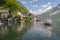 Tourists lake cruise boat on Hallstattersee by the World Heritage lakeside town in the Alps, Hallstatt, Salzkammergut, Austria