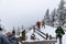 Tourists at Lake Peyto in Snow and Fog in Wintertime,
