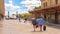 Tourists in line in train station boarding while keeping social distance due to pandemic restrictions