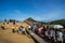 Tourists in line up for taking photo with Queen Head Rock