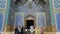 Tourists and local people at entrance to Sheikh Lotfollah Mosque in Isfahan Naqsh-e Jahan Square, Isfahan, Iran