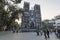 Tourists and local people walking in fron of Saint Joseph Cathedral, the most important church of Hanoi