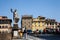 Tourists and locals crossing the historical Saint Trinity Bridge in Florence