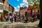 Tourists and locals in restaurants of Walplein Square in Bruges.