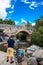 Tourists and locals at the Royal Bridge of Calicanto at the beautiful small town of Mongui in