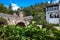 Tourists and locals at the Royal Bridge of Calicanto at the beautiful small town of Mongui in