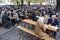 Tourists and locals visit traditional beer garden Biergarten in Munich, Bavaria, Germany. October 2014