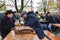 Tourists and locals visit traditional beer garden Biergarten in Munich, Bavaria, Germany. October 2014