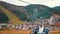 Tourists Look at the Autumn Carpathian Mountains from a Moving Ski Lift