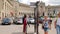 Tourists look at the city map with sights on Heldenplatz Heroes Square