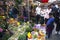 Tourists look at merchandise on amsterdam flower market
