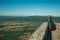 Tourists looking at the hilly landscape from the Marvao Castle