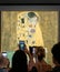 Tourists looking at The Kiss by Gustav Klimt, Vienna