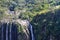 Tourists looking to Waterfall at Itaimbezinho Canyon