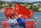 Tourists on a love bench on the shoreline of Santa Marherita Ligure, Italy