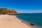 Tourists from a luxury expedition cruise ship  explore a remote beach on Naturalist Island in the Kimberley before a sightseeing