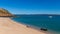 Tourists from a luxury expedition cruise ship  explore a remote beach on Naturalist Island in the Kimberley before a sightseeing