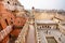 Tourists in maze of red and pink sandstone in Jaipur