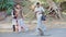 Tourists Men Girls Walk Watch Feed Monkey on Pathway in Park