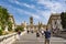 Tourists on Michelangelo stairs to Piazza del Campidoglio on top of Capitoline Hill and Palazzo Senatorio, Rome, Italy.