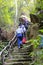 Tourists mountaineering at virgin forest resort