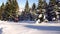 Tourists in the mountains in winter make their way through deep snow.