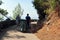 Tourists and Municipal Worker Along Walking Path