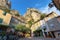 Tourists in the narrow street of thel medieval village Moustiers Sainte Marie, France