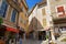 Tourists in the narrow street of thel medieval village Moustiers Sainte Marie, France