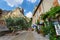 Tourists in the narrow street of thel medieval village Moustiers Sainte Marie, France