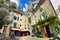 Tourists in the narrow street of thel medieval village Moustiers Sainte Marie, France