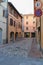 Tourists in narrow streets of old city. Vignola, Italy