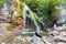 Tourists near Djur-djur waterfall in Crimea