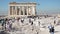 Tourists near ruins of Parthenon temple