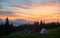 Tourists near two tents in the mountains