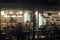 Tourists in a night cafe at the port of Chora, Naxos, Greece