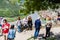 Tourists on the observation deck near the monastery of Jvari. Town Mtskheta in the background. Georgia