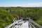 Tourists on the observation deck over the cenote Yalahau, Holbox, Quintana Roo, Mexico